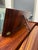 A striking mid-century modern rosewood harpsichord featuring a beautifully figured case elevated on elegant tapered legs....