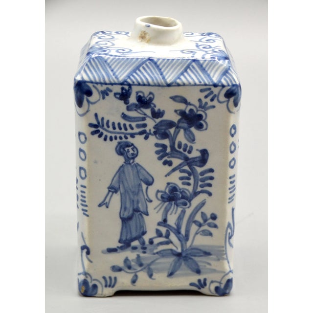 A fine 18th-Century Delft tea caddy hand painted with figures, birds and geometric decorations. This rare chinoiserie tea...