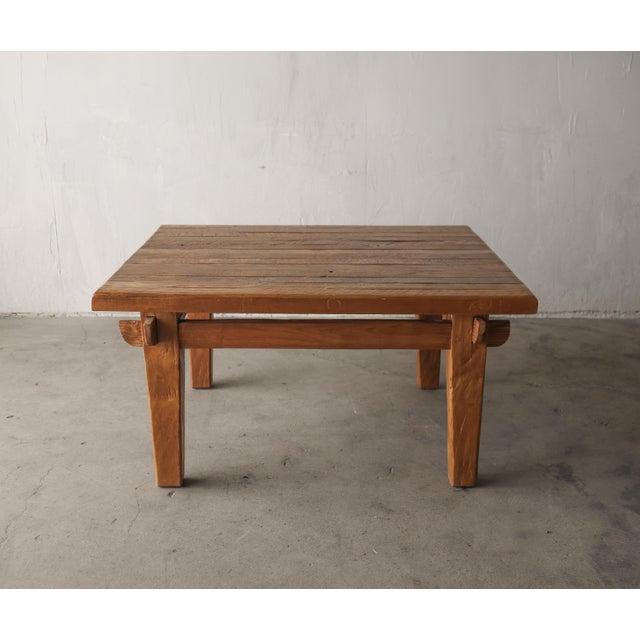 This beautiful rustic European Oak coffee table features a plank-style top and and traditional pegged mortise-and-tenon...