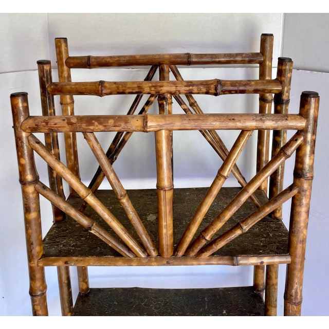 Here is a beautiful piece featuring bamboo, brass finials and a leather/embossed paper lining. The burnt bamboo is so...