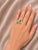 Material: Platinum - durable and elegant Stones: Emerald - 1.8 carats total Accent Stones: Brilliant Round Diamonds - 0.6...