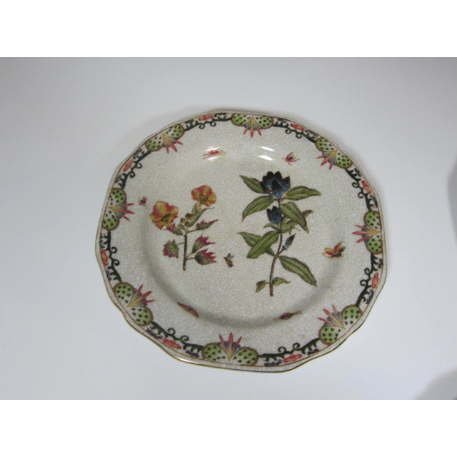 Set of three decorative floral plates. They havecrackle backgrounds with Handpainted colorful floral centers and floral...