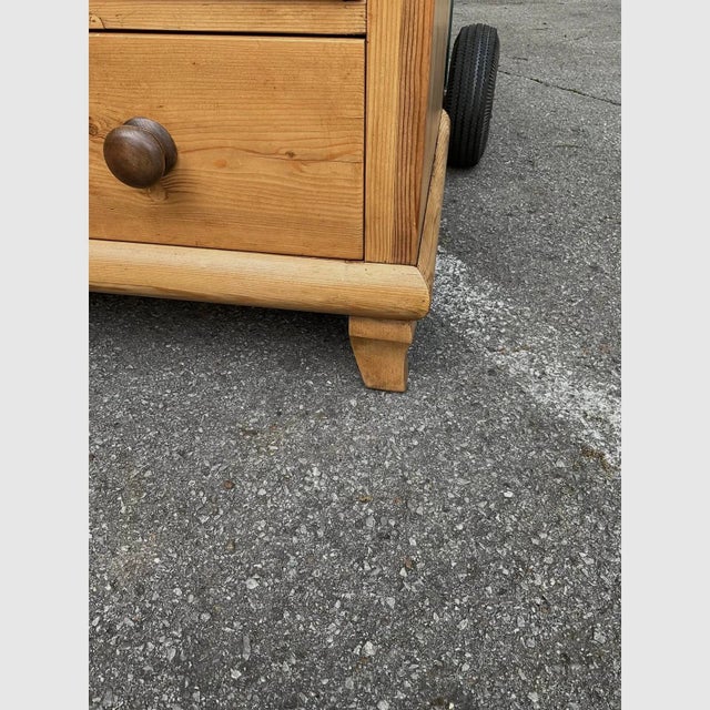 This 19th Century English pine chest has a beautiful warm tone patina with dark stained knobs. All of the drawers slide...