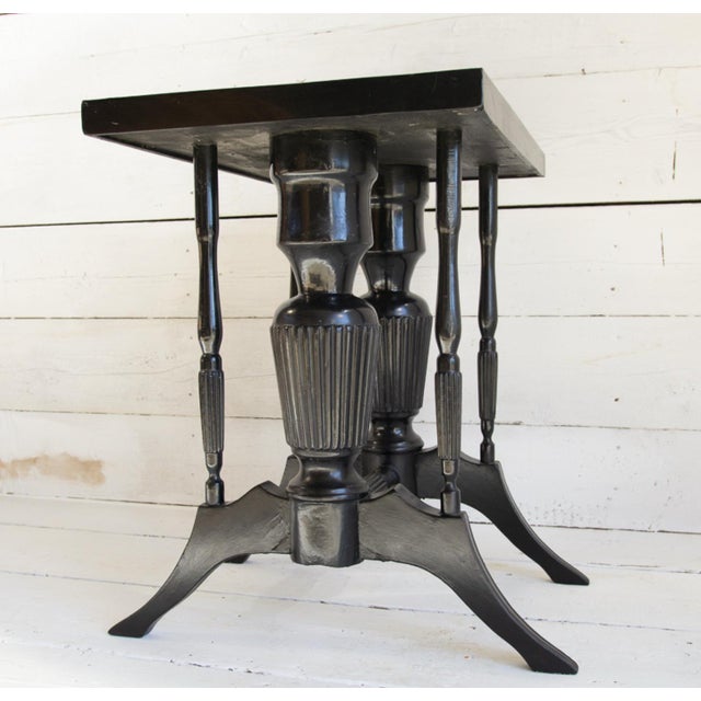 This small Art Deco table was crafted from ebonized wood, following the fashion of the 1930s and 1940s. It features thin,...