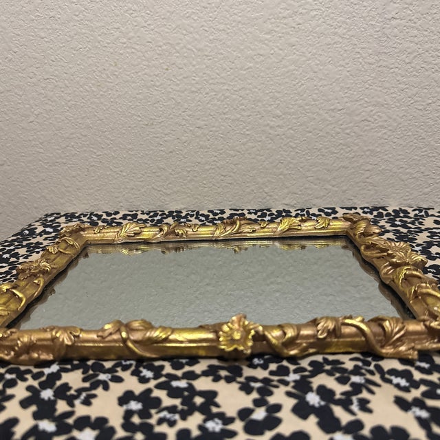 Add a touch of timeless charm to your space with this beautiful small ornate wall mirror. Featuring an intricate...