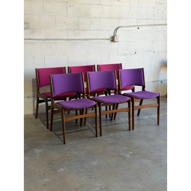 These organic dining chairs showcase curved floating seat pads and contoured backrests crafted from warm solid rosewood...