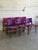 These organic dining chairs showcase curved floating seat pads and contoured backrests crafted from warm solid rosewood...