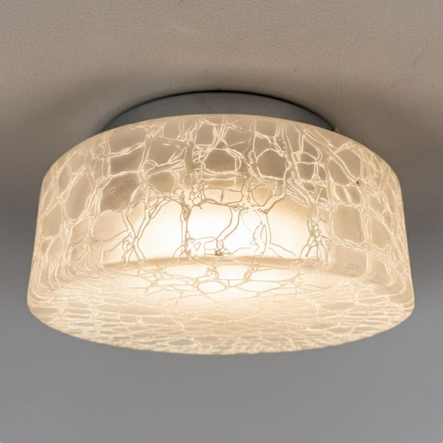 A splendid Italian-designed ceiling lamp dating back to the 1970s. An iconic piece of Space Age style, capable of creating...