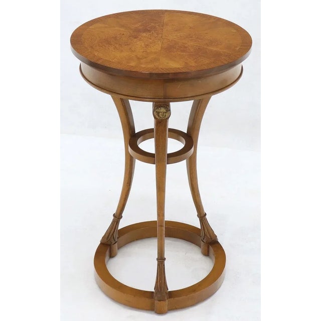 Round burl wood tops neoclassical guerdons pedestals shape tables. Baker quality.