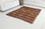 This is a vintage Turkish Oushak rug from the Mid 20th Century. The piece was hand-knotted.