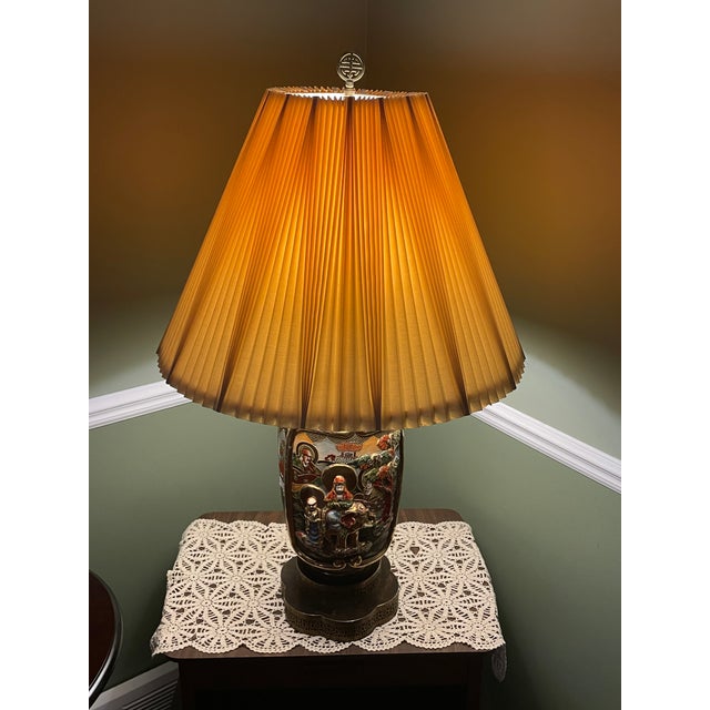 This striking mid-century Japanese Satsuma-style porcelain temple jar has been beautifully converted into a substantial...