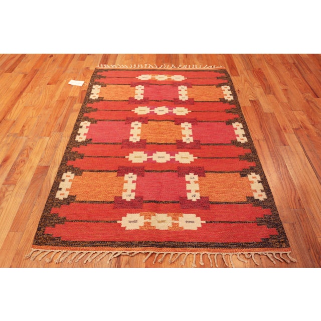 Vibrant Vintage Swedish Kilim Rug with Geometric Motifs in Sunset Tones Signed GS, Country of Origin: Sweden, Circa Date:...