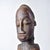 A wood-carved Baule figure with body scarification and holding its stomach. Baule wood carving is a long-standing artistic...