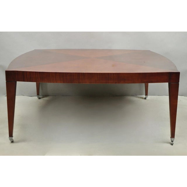 Baker Harlequin Modern Cross Inlay Top Large Coffee Cocktail Table with Tapered Legs on Wheels. Circa Late 20th Century....