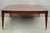 Baker Harlequin Modern Cross Inlay Top Large Coffee Cocktail Table with Tapered Legs on Wheels. Circa Late 20th Century....