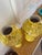 Gorgeous and dramatic pair of Mid-Century ceramic urns. bright, bold yellow in color with chocolate brown splatter...