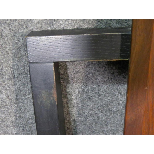 Midcentury walnut and black wood headboard.