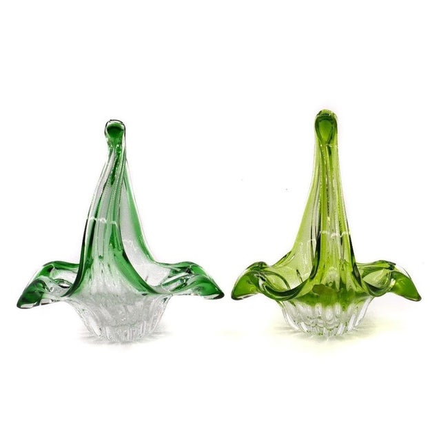 This is a precious pair of blown glass baskets, realized in Belgium in the 1970s. Couple of baskets with handle completely...