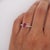 18K white gold ring featuring a GIA certified 1.25 carat oval Burma ruby, heated with minor residue, accented by 0.13...
