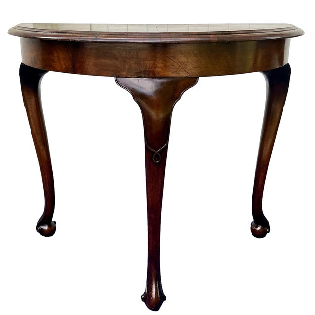 This listing is for one Demi lune side table with dark wood finish resting on carved cabriole legs with carved ball feet....