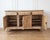 A striking 18th century Italian credenza crafted in richly grained walnut, showcasing the refined balance of architectural...