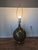 Mid-Century 39 in tall lamp. Metal base with an open weave. Gold gilt throughout the push button on the bottom to light up...