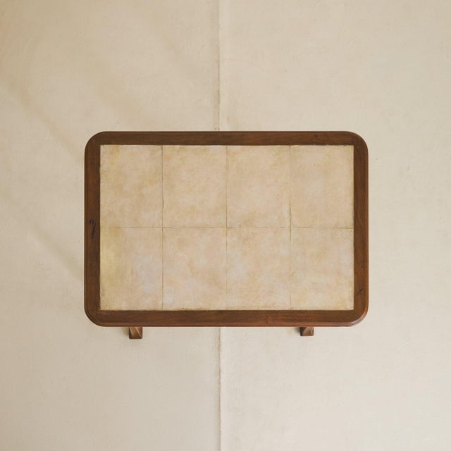 A study in proportion and material, this petite writing desk, dating to the early 1900s, reflects the sensibility of the...
