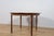 Round extending dining table manufactured by the renowned British furniture maker McIntosh in the 1960s, representing an...