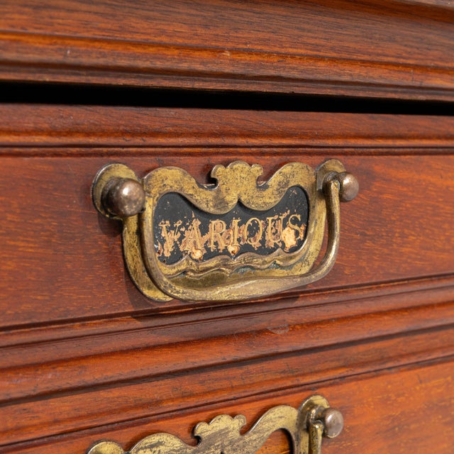 Here is a chest, its dark mahogany, 5 drawers with brass inlay banding the first thing to catch the eye. The piece dates...