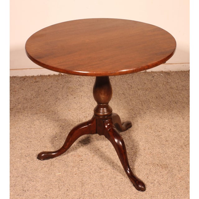 Elegant English mahogany side table from the early 19th century. This small, unusual model is shorter than usual,...
