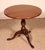 Elegant English mahogany side table from the early 19th century. This small, unusual model is shorter than usual,...
