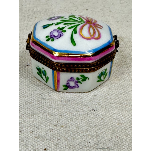 Vintage octagonal hand painted Limoges box decorated with a floral bouquet. This is a pew-owned item so please see all...
