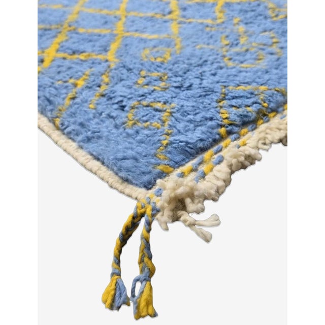 Blue Boujad Rug – Handmade Moroccan Berber Wool Carpet This striking handmade Moroccan Boujad rug features a vibrant sky...