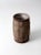 This is an antique primitive barrel. The rustic wooden keg features wood slats and metal banding.