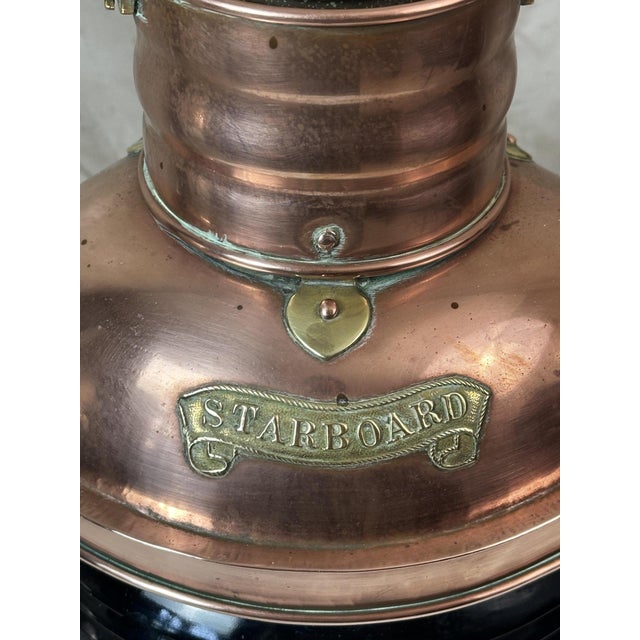 Antique early 20th-century ship's navigation lantern, crafted from copper and brass. This lantern was used to signal the...
