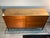 Mid-century modern 8-drawer dresser with a warm walnut finish and classic tapered legs. Carefully refinished to highlight...