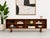 Stunning Danish Mid-Century Modern bookcase / credenza in richly grained rosewood, made in Denmark circa 1960s. Its deep,...