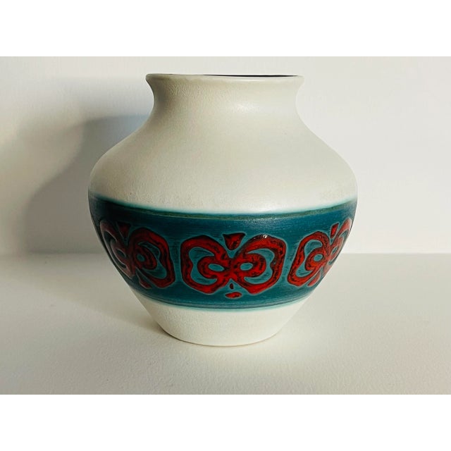 Mid Century Modern German Ceramic Matte Finish Bulbous Vase. Interior has a multi-color drip glaze. Marked underneath.