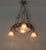 Superb Muller Frères Lunéville signed Art Deco pink frosted and wrought iron chandelier. Circa 1925. The chandelier...