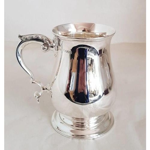 A fine Victorian English sterling silver mug or tankard by the celebrated Chawner & Co., hallmarked in London for 1882....