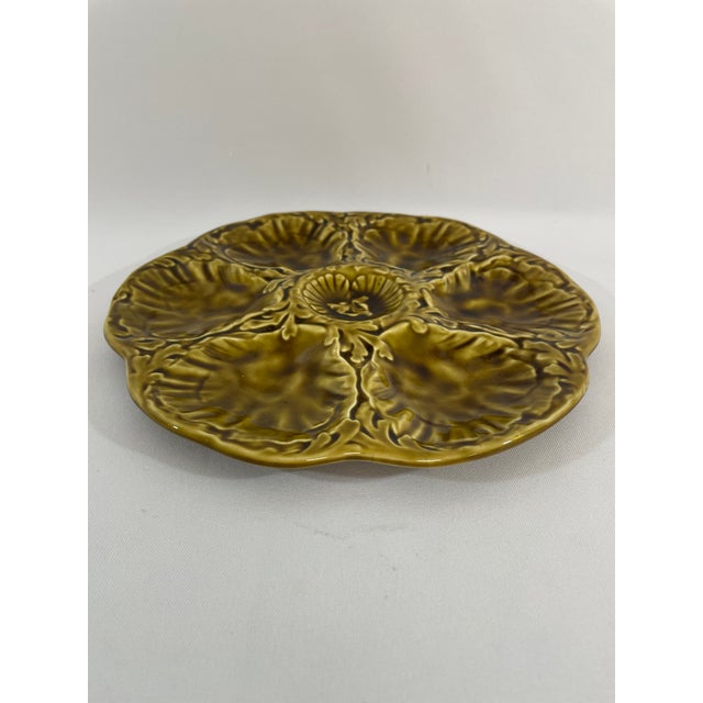 A striking glazed earthenware French Majolica (or barbotine) Oyster Plate crafted by the famous Gien workshop in France....