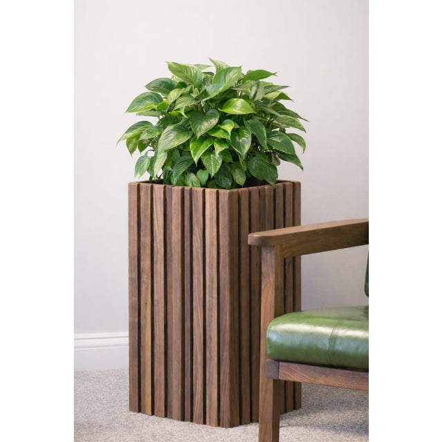This solid wood slatted planter box is handcrafted by LIVE ONE'S in Wake Forest, North Carolina. The slatted body is...