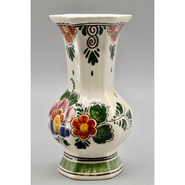 Mid Century Dutch Delft polychrome vase, hand painted in vibrant colors. It captures the elegance and warmth of...