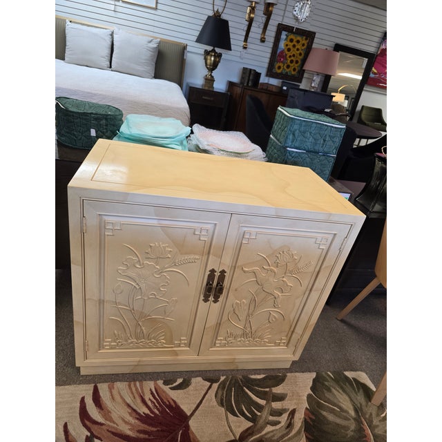 Vintage Henredon faux goatskin cabinet is a timeless statement piece that blends Hollywood Regency with the exceptional...