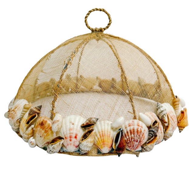 Elevate your outdoor dining or coastal kitchen with this beautiful, artisanal mesh food cover. Designed as a functional...