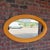 A beautiful large oval wall mirror in the style of Gabriella Crespi, featuring a sculptural frame wrapped in tightly...