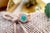 Gold ring with cabochon-shaped emerald surrounded by brilliant-cut diamonds (37). Metal: Gold. Origin: European. Brand:...