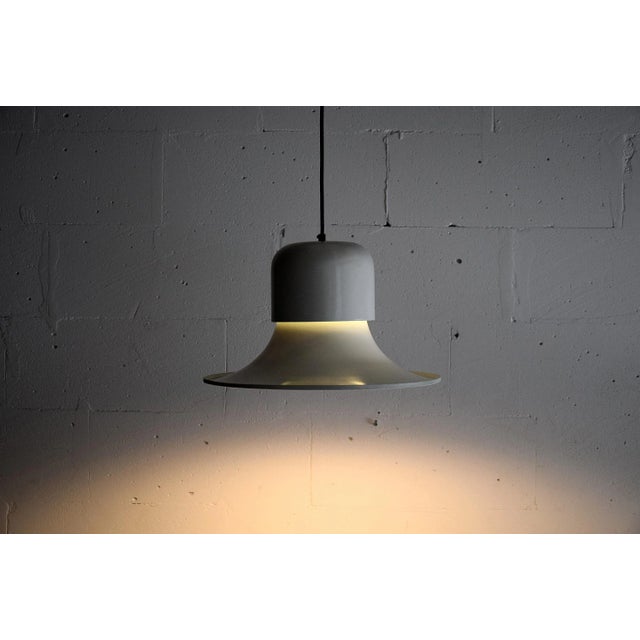 Late 1960’s white enameled Campana pendant designed by Stilnovo. The pendant is in perfect working order and in great...