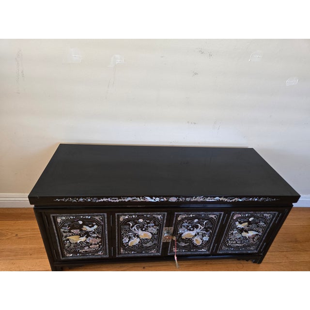It is thought that this beautiful vintage scholar's chest was made in Korea around the 1970's. It has a traditional black...