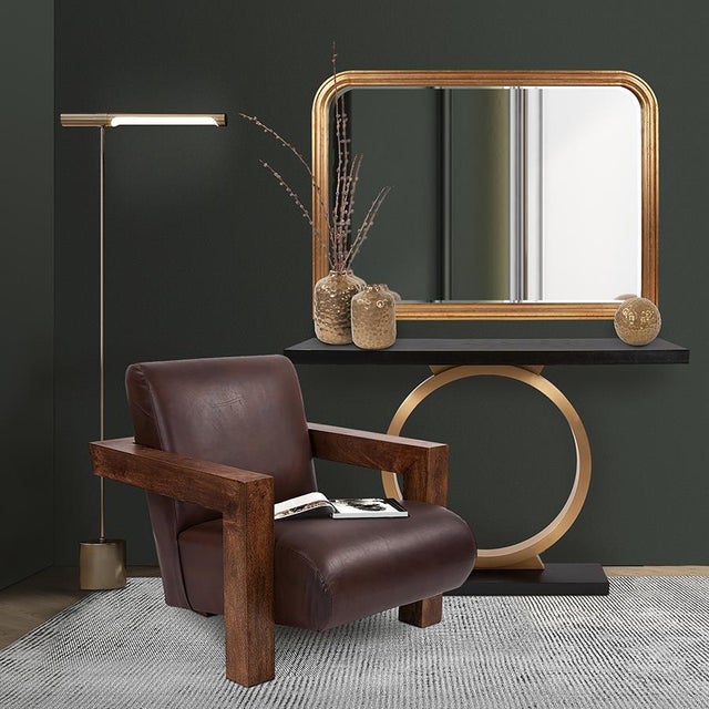 The Annular Console Table pairs dark ebony wood with a brushed brass center circle for a striking contrast. Handcrafted...